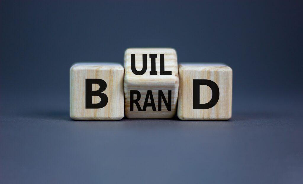 Die with aligned brand and build text